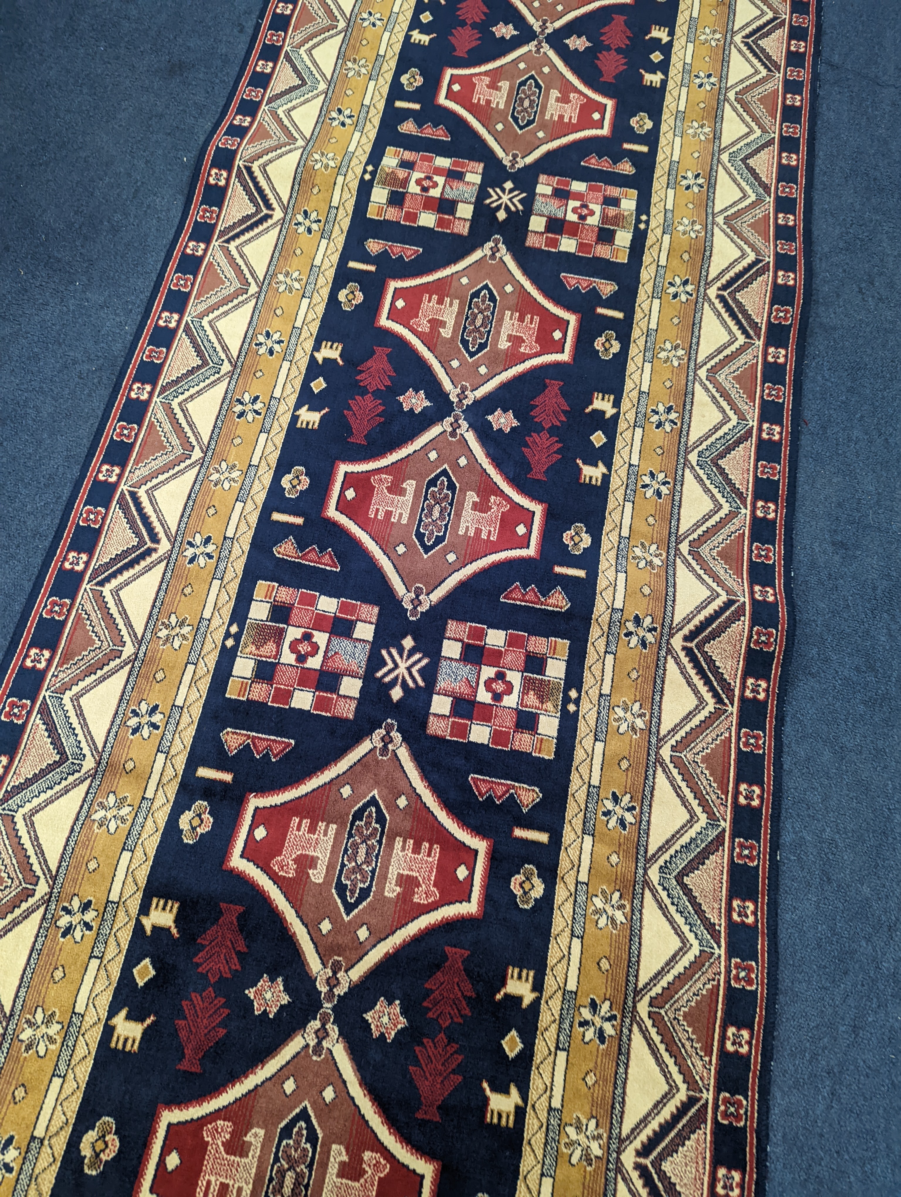 A small Caucasian style runner, 230 x 69cm